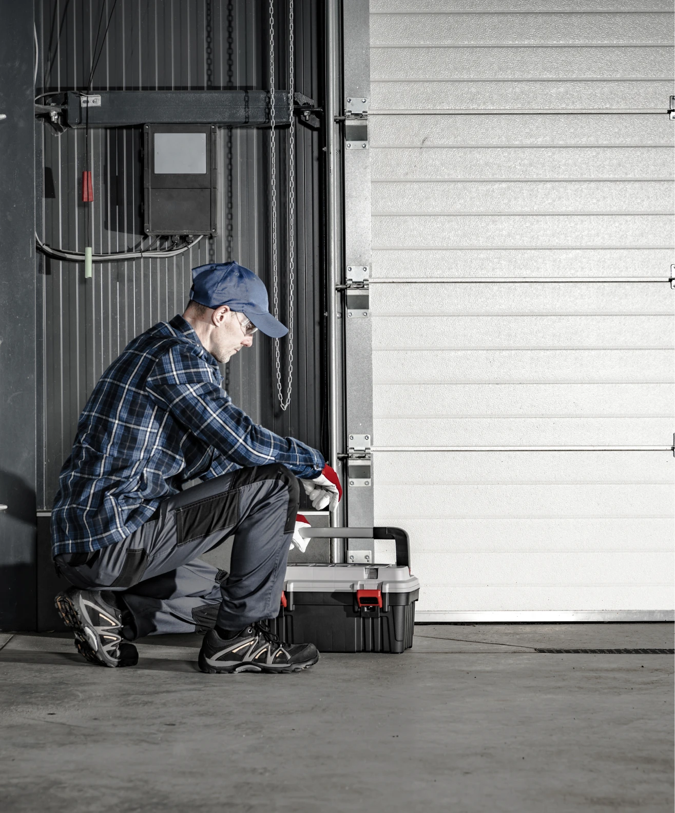Man in plaid shirt with toolbox